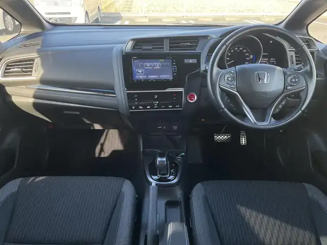 ホンダ フィット ハイブリット S ホンダセンシング 鳥取県 2018(平30)年 5.7万km プレミアムホワイトパールⅡ 純正ナビ／ＴＶ／ＤＶＤ／ＣＤ／ＢＴ/バックカメラ/ビルトインＥＴＣ/ドライブレコーダー/ホンダセンシング/レーダークルーズコントロール/レーンアシスト/パドルシフト/ＬＥＤヘットライト/フォグライト/純正エアロパーツ/リヤルーフスポイラー/純正１６インチアルミホイール/プッシュエンジンスタート/アイドリングストップ/フロアマット/ドアバイザー