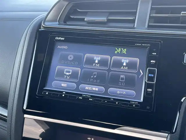 ホンダ フィット ハイブリット S ホンダセンシング 鳥取県 2018(平30)年 5.7万km プレミアムホワイトパールⅡ 純正ナビ／ＴＶ／ＤＶＤ／ＣＤ／ＢＴ/バックカメラ/ビルトインＥＴＣ/ドライブレコーダー/ホンダセンシング/レーダークルーズコントロール/レーンアシスト/パドルシフト/ＬＥＤヘットライト/フォグライト/純正エアロパーツ/リヤルーフスポイラー/純正１６インチアルミホイール/プッシュエンジンスタート/アイドリングストップ/フロアマット/ドアバイザー