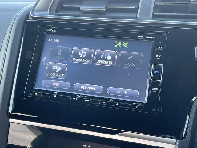 ホンダ フィット ハイブリット S ホンダセンシング 鳥取県 2018(平30)年 5.7万km プレミアムホワイトパールⅡ 純正ナビ／ＴＶ／ＤＶＤ／ＣＤ／ＢＴ/バックカメラ/ビルトインＥＴＣ/ドライブレコーダー/ホンダセンシング/レーダークルーズコントロール/レーンアシスト/パドルシフト/ＬＥＤヘットライト/フォグライト/純正エアロパーツ/リヤルーフスポイラー/純正１６インチアルミホイール/プッシュエンジンスタート/アイドリングストップ/フロアマット/ドアバイザー