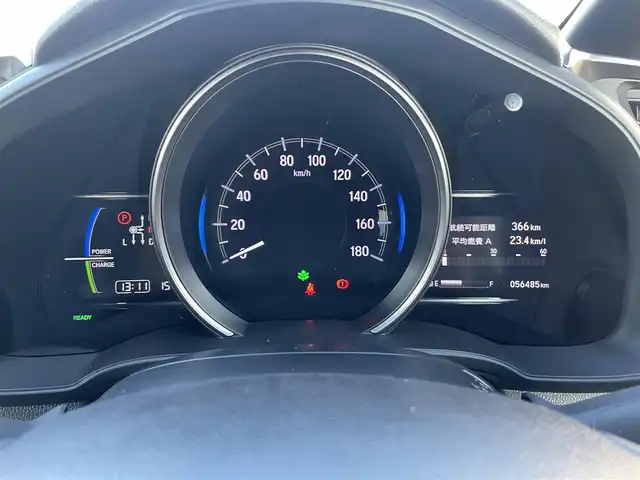 ホンダ フィット ハイブリット S ホンダセンシング 鳥取県 2018(平30)年 5.7万km プレミアムホワイトパールⅡ 純正ナビ／ＴＶ／ＤＶＤ／ＣＤ／ＢＴ/バックカメラ/ビルトインＥＴＣ/ドライブレコーダー/ホンダセンシング/レーダークルーズコントロール/レーンアシスト/パドルシフト/ＬＥＤヘットライト/フォグライト/純正エアロパーツ/リヤルーフスポイラー/純正１６インチアルミホイール/プッシュエンジンスタート/アイドリングストップ/フロアマット/ドアバイザー