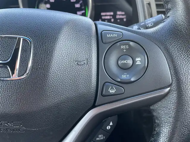 ホンダ フィット ハイブリット S ホンダセンシング 鳥取県 2018(平30)年 5.7万km プレミアムホワイトパールⅡ 純正ナビ／ＴＶ／ＤＶＤ／ＣＤ／ＢＴ/バックカメラ/ビルトインＥＴＣ/ドライブレコーダー/ホンダセンシング/レーダークルーズコントロール/レーンアシスト/パドルシフト/ＬＥＤヘットライト/フォグライト/純正エアロパーツ/リヤルーフスポイラー/純正１６インチアルミホイール/プッシュエンジンスタート/アイドリングストップ/フロアマット/ドアバイザー