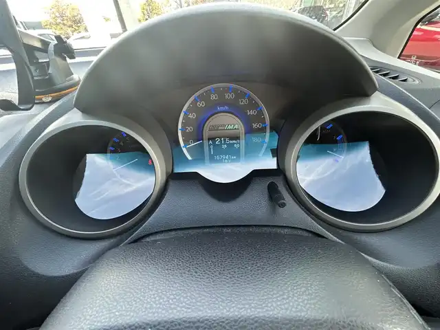 ホンダ フィット ハイブリット スマート セレクション 愛知県 2011(平23)年 15.6万km プレミアムホワイトパール ワンオーナー/社外7V型メモリナビ【Bluetooth SD ワンセグ　FM AM 品：AVIC-MRZ99】/ETC/ドライブレコーダー/オートライト/クルーズコントロール/自動駐車システム/ステアリングリモコン/電動格納ドアミラー/純正フロアマット/Wエアバック/取扱説明書