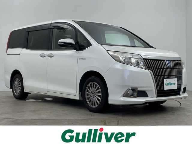 トヨタ エスクァイア ハイブリッド Gi 鹿児島県 2014(平26)年 14.6万km ホワイトパールクリスタルシャイン ワンオーナー/社外ナビ/（フルセグ/DVD/CD）/フリップダウンモニター/両側パワースライドドア/クルーズコントロール/ワイヤレス充電/レザーシート/シートヒーター/ビルドインETC/リアサンシェード/スマートキー/プッシュスタートボタン/純正フロアマット