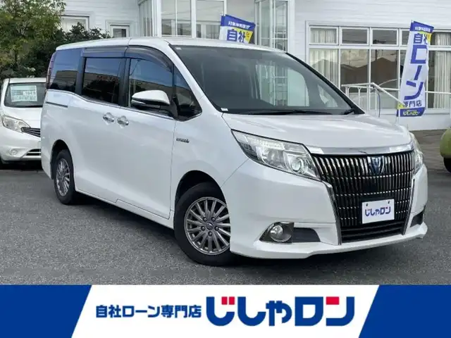 トヨタ エスクァイア ハイブリッド Gi 愛知県 2014(平26)年 14.7万km ホワイトパールクリスタルシャイン (株)IDOMが運営する【じしゃロン名古屋鳴海店】の自社ローン専用車両になりますこちらは現金またはオートローンご利用時の価格です。自社ローンご希望の方は別途その旨お申付け下さい/ ワンオーナー/社外ナビ/（フルセグ/DVD/CD）/フリップダウンモニター/両側パワースライドドア/クルーズコントロール/ワイヤレス充電/レザーシート/シートヒーター/ビルドインETC/リアサンシェード/スマートキー/プッシュスタートボタン/純正フロアマット