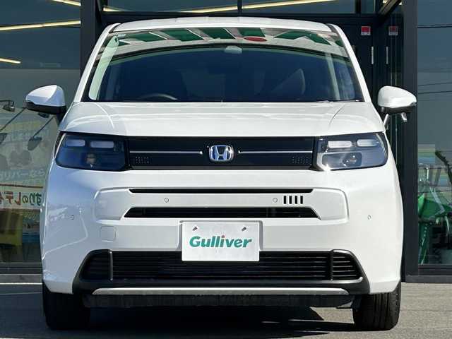 ホンダ フリード ハイブリット e:HEV AIR EX 愛媛県 2025(令7)年 0.1千km プラチナホワイトパール 純正ナビ（Bluetooth/フルセグTV）/アダプティブクルーズコントロール/バックカメラ/AppleCarPlay/AndroidAuto/3列シート/ウォークスルー/両側パワースライドドア/純正15インチアルミホイール/ホンダセンシング/ブラインドスポットモニター/ステアリングリモコン/前後コーナーセンサー/LEDヘッドライト/スマートキー