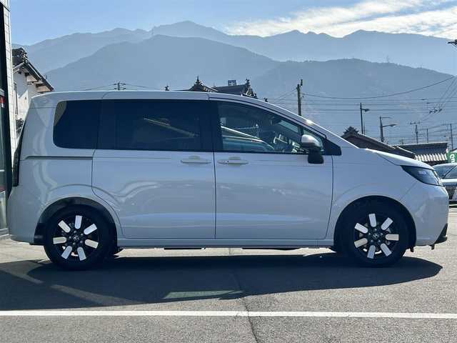 ホンダ フリード ハイブリット e:HEV AIR EX 愛媛県 2025(令7)年 0.1千km プラチナホワイトパール 純正ナビ（Bluetooth/フルセグTV）/アダプティブクルーズコントロール/バックカメラ/AppleCarPlay/AndroidAuto/3列シート/ウォークスルー/両側パワースライドドア/純正15インチアルミホイール/ホンダセンシング/ブラインドスポットモニター/ステアリングリモコン/前後コーナーセンサー/LEDヘッドライト/スマートキー