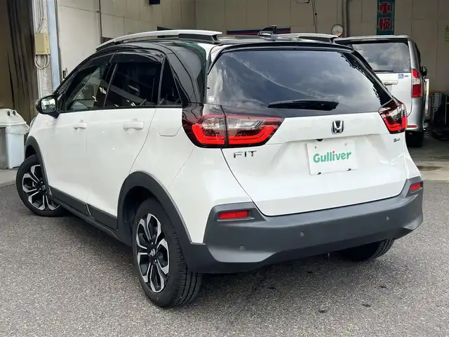 ホンダ フィット e:HEVクロスター 鹿児島県 2020(令2)年 4.4万km プラチナホワイトパール ブラックルーフ/9チンチプレミアムインターナビ(VXU-215FTi)/フロント&バックカメラ/ステアリングスイッチ/USB/地デジ/ETC/コムテック前後ドラレコ(ZDR 017)/ユピテルGPSレーダー(LS2000)/ホンダセンシング/LEDヘッドライト/ルーフレール/シャークフィンアンテナ/スマートキー×2本/取説&保証書有り/ダンロップ エナセーブ 2024年製4本