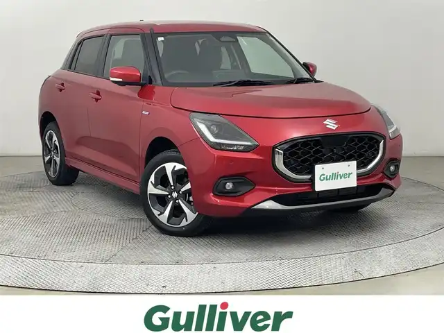 スズキ スイフト HYBRID MZ 道央・札幌 2023(令5)年 0.5万km フレイムオレンジPM ・４WD/・寒冷地仕様/・純正ディーラーOPナビ/・CD/DVD/BT/SD/USB/フルセグTV/・AppleCarplay/AndroidAuto/HDMI/・全方位カメラ（F.S.B.）/・衝突被害軽減ブレーキ/・レーンキープアシスト/・レーダークルーズコントロール/・コーナーセンサー/・横滑り防止装置/・BSM(ブラインドスポットモニター)/・オートブレーキホールド/・アイドリングストップ/・オートライト/・LEDヘッドライト/・D+N席シートヒーター/・パドルシフト/・純正１６インチAW/・プッシュスタート/・スマートキー/・スペアキー（１つ）/・保証書