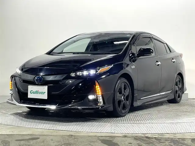 トヨタ プリウス ＰＨＶ A プレミアム 大阪府 2021(令3)年 2.3万km アティチュードブラックマイカ モデリスタエアロ　アルパインナビ　黒革シート　レーダークルコン　バックカメラ　ＥＴＣ　ドラレコ　シートヒーター／エアコン　ハンドルヒーター　ＢＳＭ　タイマー充電　ＨＵＤ　パワーシート　パークアシスト