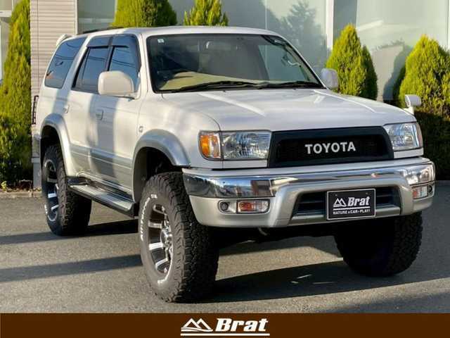 トヨタ ハイラックス サーフ SSR－X 長崎県 2001(平13)年 15.6万km ホワイト/シルバーM NALDIウッドステアリング/エンジンスターター/ミラー一体型バックカメラ/リフトアップ/マーテルギアアルミホイール/サンルーフ