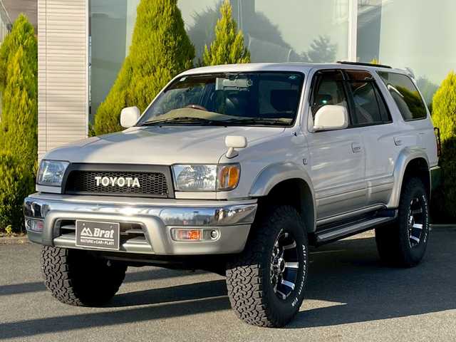 トヨタ ハイラックス サーフ SSR－X 長崎県 2001(平13)年 15.6万km ホワイト/シルバーM NALDIウッドステアリング/エンジンスターター/ミラー一体型バックカメラ/リフトアップ/マーテルギアアルミホイール/サンルーフ