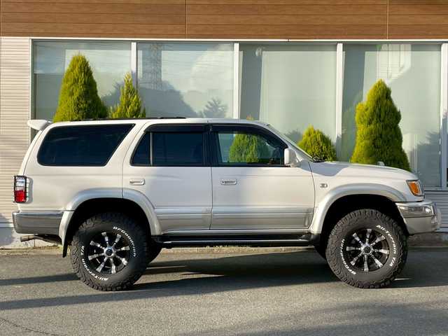 トヨタ ハイラックス サーフ SSR－X 長崎県 2001(平13)年 15.6万km ホワイト/シルバーM NALDIウッドステアリング/エンジンスターター/ミラー一体型バックカメラ/リフトアップ/マーテルギアアルミホイール/サンルーフ