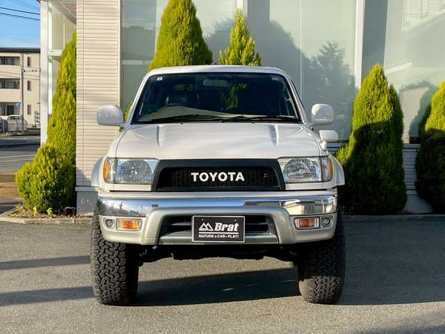 トヨタ ハイラックス サーフ SSR－X 長崎県 2001(平13)年 15.6万km ホワイト/シルバーM NALDIウッドステアリング/エンジンスターター/ミラー一体型バックカメラ/リフトアップ/マーテルギアアルミホイール/サンルーフ