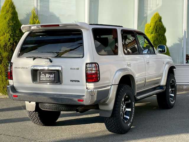 トヨタ ハイラックス サーフ SSR－X 長崎県 2001(平13)年 15.6万km ホワイト/シルバーM NALDIウッドステアリング/エンジンスターター/ミラー一体型バックカメラ/リフトアップ/マーテルギアアルミホイール/サンルーフ