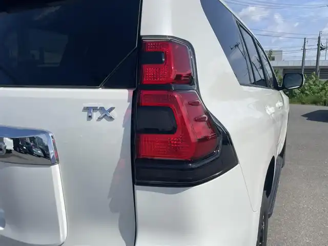 トヨタ ランドクルーザー プラド TX 山形県 2023(令5)年 1.9万km ホワイトパールクリスタルシャイン ディーゼル/４WD/セーフティセンス/ディスプレイオーディオ/　【CD DVD AUX USB BT】/バックカメラ/ドライブレコーダー/ETC/ステアリングスイッチ/レーダークルーズコントロール/革調シートカバー/横滑り防止装置/コーナーセンサー/LEDライト/フォグランプ/ウィンカーミラー/保証書、取説あり