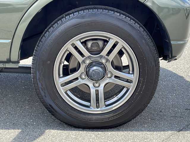 スズキ ジムニー ランドベンチャー 山梨県 2014(平26)年 5.3万km クールカーキPM 社外ＳＤナビ　/社外ＥＴＣ　/フルセグＴＶ　/ＣＤ　/Ｂｌｕｅｔｏｏｔｈ　/ドラレコ　/純正フロアマット　/レザーシート　/運転席シートヒーター　/背面タイヤ　/純正１６インチＡＷ　/ＡＢＳ　/ＨＩＤヘッドライト　/パワステ