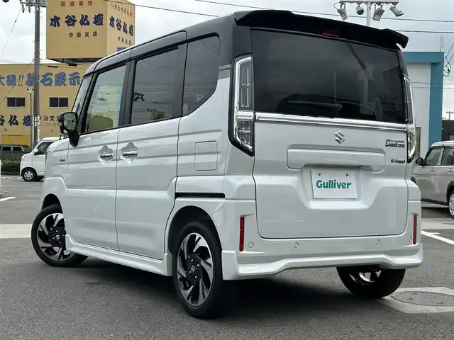 スズキ スペーシア カスタム HYBRID XS 愛媛県 2023(令5)年 0.1千km ピュアホワイトパール/ブラック2トーン 登録時走行距離：8Km/横滑り防止装置/衝突軽減システム/レーンキープアシスト/パーキングアシスト/アイドリングストップ/エンジンスタートボタン/追従クルコン/ＡＢS/LEDヘッドライト/オートライト/両側パワスラ/スマートキー/ハンドルヒーター/シートヒーター/純正アルミホイール