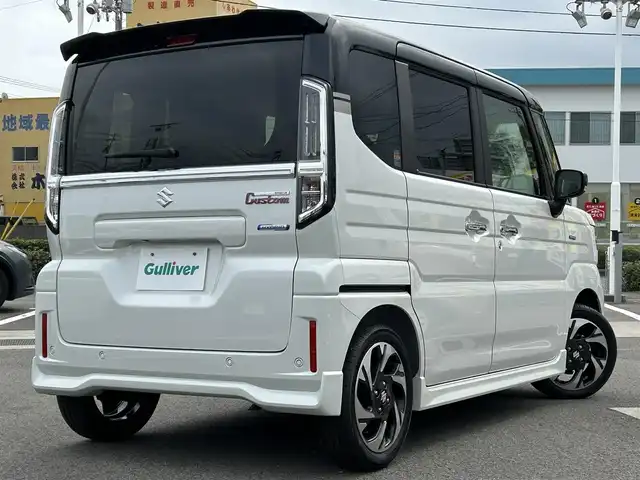 スズキ スペーシア カスタム HYBRID XS 愛媛県 2023(令5)年 0.1千km ピュアホワイトパール/ブラック2トーン 登録時走行距離：8Km/横滑り防止装置/衝突軽減システム/レーンキープアシスト/パーキングアシスト/アイドリングストップ/エンジンスタートボタン/追従クルコン/ＡＢS/LEDヘッドライト/オートライト/両側パワスラ/スマートキー/ハンドルヒーター/シートヒーター/純正アルミホイール