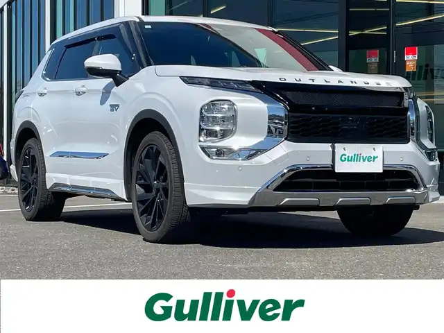 三菱 アウトランダー ＰＨＥＶ P 鹿児島県 2023(令5)年 1.7万km ホワイトダイヤモンド マイパイロット/サンルーフ/純正ナビ/（Bluetooth/フルセグTV/USB）/全方位カメラ/電動リアゲート/LEDヘッドライト/レザーシート/全席シートヒーター/純正20インチアルミホイール/スマートキー