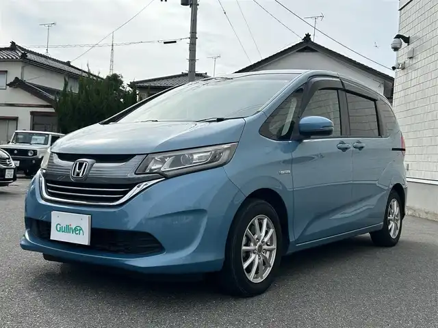 ホンダ フリード＋ ハイブリット G ホンダセンシング 山形県 2017(平29)年 9.4万km ブルーホライゾンM ホンダセンシング /メモリナビフルセグTV/バックカメラ/左側パワースライドドア/社外１５インチアルミ/レーンキープアシスト/オートライト/ワンオーナー /保証書・取説/スペアキー
