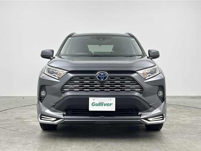 トヨタ ＲＡＶ４ ハイブリットG 三重県 2021(令3)年 7.7万km グレーメタリック 禁煙車/純正ディスプレイオーディオ/・フルセグ・Bluetooth・USB・MiraCast/パノラミックビューモニター/モデリスタフルエアロ/ブラインドスポットモニター/トヨタセーフティセンス/・プリクラッシュセーフティ/・オートマチックハイビーム/・レーントレーシングアシスト/・ロードサインアシスト/・レーダクルーズコントロール/パワーバックドア/ステアリングヒーター/ルーフレール/前席シートヒーター/運転席パワーシート（メモリ付き）/LEDヘッドライト（オート）/ビルトインETC/スペアタイヤ/電子パーキング/パーキングサポートブレーキ/置くだけ充電