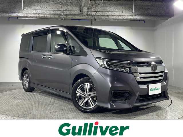 ホンダ ステップワゴン スパーダ ハイブリッド G ホンダセンシング 沖縄県 2019(平31)年 2.5万km モダンスティールM 禁煙車/両側パワースライド/純正７インチナビ/・ＣＤ／ＤＶＤ／Ｂｌｕｅｔｏｏｔｈ／フルセグＴＶ　/両側パワースライド/マルチビューカメラ/純正１６インチアルミ/ビルトインＥＴＣ/ドライブレコーダー前後/ホンダセンシング/●衝突軽減ブレーキ/●誤発進抑制機能/●歩行者事故低減ステアリング/●路外逸脱抑制機能/●アダプティブ・クルーズ・コントロール/●車線維持支援システム/●先行車発進お知らせ機能/●標識認識機能/保証書/取扱説明書