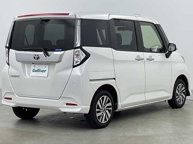 トヨタ ルーミー カスタムG 福島県 2023(令5)年 0.8万km パールホワイトⅢ ・４WD/・寒冷地仕様/・社外ナビ（AVN-LBS01）/・Bluetooth/・バックカメラ/・両側パワースライドドア/・スマートアシスト/・先行車発進お知らせ/・衝突被害軽減ブレーキ/・車線逸脱警報/・標識認識機能/・ふらつき警報/・プッシュスタート/・スマートキー/・フロントワイパーデアイサー/・車速連動間欠ワイパー/・クルーズコントロール/・クリアランスソナー/・ETC/・電動パーキングブレーキ/・ミラーヒーター/・オートマチックハイビーム/・LEDヘッドライト/・アイドリングストップ/・革巻きステアリング/・横滑り防止装置/・オートライト