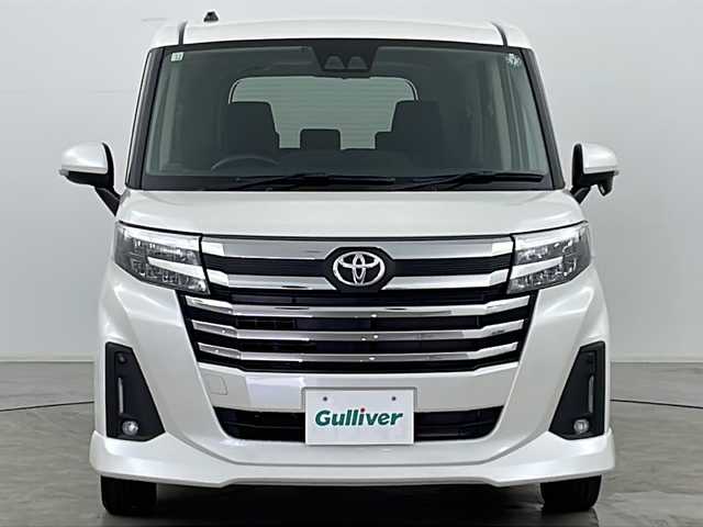 トヨタ ルーミー カスタムG 福島県 2023(令5)年 0.8万km パールホワイトⅢ ・４WD/・寒冷地仕様/・社外ナビ（AVN-LBS01）/・Bluetooth/・バックカメラ/・両側パワースライドドア/・スマートアシスト/・先行車発進お知らせ/・衝突被害軽減ブレーキ/・車線逸脱警報/・標識認識機能/・ふらつき警報/・プッシュスタート/・スマートキー/・フロントワイパーデアイサー/・車速連動間欠ワイパー/・クルーズコントロール/・クリアランスソナー/・ETC/・電動パーキングブレーキ/・ミラーヒーター/・オートマチックハイビーム/・LEDヘッドライト/・アイドリングストップ/・革巻きステアリング/・横滑り防止装置/・オートライト