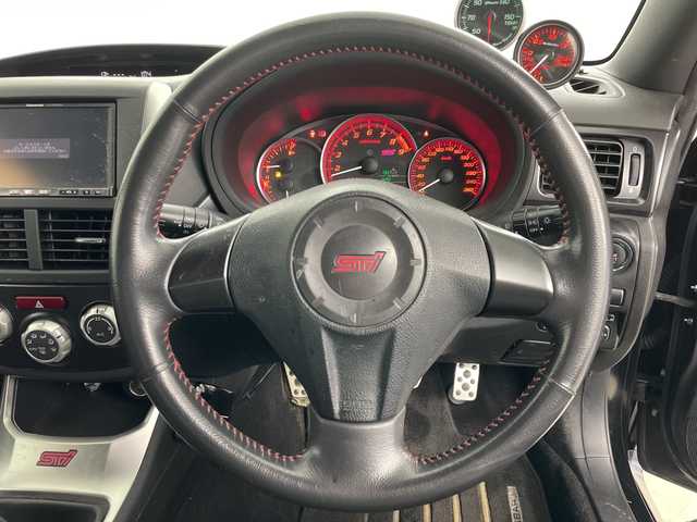 スバル インプレッサ ＷＲＸ STi 道央・札幌 2010(平22)年 11.5万km オブシディアンブラックパール ・４ＷＤ/・社外ナビ＆ＴＶ＆ＤＶＤ＆ＣＤ/・ＳＩ－ＤＲＩＶＥ/・Ｃ－ＤＩＦＦ/・ＳＴＩ１８インチアルミ/・追加補器メーター（ブースト計他）/・社外ＥＴＣ/・ハーフレザーシート/・キセノンヘッドライト/・横滑り防止装置