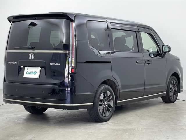 ホンダ ステップワゴン スパーダ 道央・札幌 2023(令5)年 2.1万km クリスタルブラックパール ・ワンオーナー/・４WD/・寒冷地仕様/・純正ナビ（LXM-237VFLi）/・Bluetooth/CD/DVD/HDMI/フルセグTV/・純正フリップダウンモニター/・バックカメラ/・両側パワースライドドア/・アダプティブクルーズコントロール/・ホンダセンシング/・衝突被害軽減ブレーキ/・踏み間違い軽減/・路外逸脱警報/・先行車発進お知らせ/・標識認識機能/・ブラインドスポットモニター/・パワーバックドア/・LEDヘッドライト/・オートライト/・オートマチックハイビーム/・前席シートヒーター/・ハーフレザーシート/・プッシュスタート/・スマートキー/・パドルシフト/・電動パーキング/・ウォークスルー/・革巻きステアリング/・ヘッドライトリベライザー/・ECON/・横滑り防止装置/・アイドリングストップ