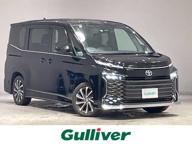 トヨタ ヴォクシー ハイブリッド S－Z 宮城県 2023(令5)年 5.4万km アティチュードブラックマイカ トヨタセーフティセンス/・プリクラッシュセーフティ/・レーンチェンジアシスト/・レーントレーシングアシスト/・レーンディパーチャーアラート/・レーダークルーズコントロール/・オートマチックハイビーム/・ロードサインアシスト/・プロアクティブドライビングアシスト/ブラインドスポットモニター/純正10.5インチディスプレイオーディオ/・バックカメラ/・フルセグTV/Bluetooth/CD/DVD/・HDMI/Miracast/・ビルトインETC2.0/・社外前後ドライブレコーダー/純正13.2型有機EL後席ディスプレイ/ユニバーサルステップ/前後コーナーセンサー/電子パーキング/・オートブレーキホールド/100V充電/革巻きステアリング/・ステアリングリモコン/ハーフレザーシート/・シートヒーター（運転席/助手席）/・ウォークスルー/三眼LEDヘッドライト/・オートライト/・フォグランプ/プッシュスタート/・スマートキー/純正アルミホイール/純正フロアマット/ドアバイザー