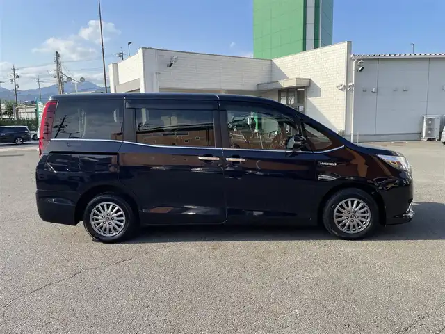 トヨタ エスクァイア ハイブリッド Gi 静岡県 2016(平28)年 15.8万km スパークリングブラックパールクリスタルシャイン ワンオーナー/Toyota Safety Sense/・プリクラッシュセーフティ/・車線逸脱警報/純正メモリナビ/・フルセグTV/Bluetooth/SD/DVD/CD/AM/FM/バックカメラ/両側パワースライドドア/LEDヘッドライト/オートライト/フォグライト/ETC/レザーシート/シートヒーター/スマートキーx2/プッシュスタート/純正１５インチAW/取扱説明書/新車時保証書