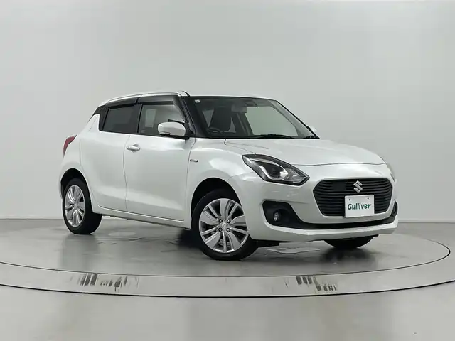 スズキ スイフト HYBRID ML 道東・釧路十勝 2019(平31)年 5.8万km ピュアホワイトP ・4WD/・セーフティパッケージ/・デュアルセンサーブレーキサポート/・純正ナビCN-RZ746W/(フルセグTV/CD/DVD/Bluetooth/USB/SD/AM/FM)/・バックカメラ/・レーダークルーズコントロール/・パドルシフト/・シートヒーター/・ビルトインETC/・アイドリングストップ/・オートLEDヘッドライト/・スマートキー/・プッシュスタート/・エンジンスターター/・純正１６インチアルミホイール