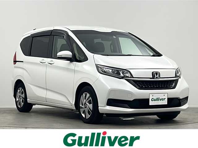 ホンダ フリード ハイブリット G 大阪府 2023(令5)年 3.5万km プラチナホワイトパール 純正7インチSDナビ【VXM-234VFi】/【AM/FM/CD/DVD/Bluetooth/フルセグTV】/バックカメラ/ETC2.0/追従型クルーズコントロール/衝突軽減システム/前後コーナーセンサー/両側電動パワースライドドア/純正フロアマット/LEDヘッドライト/スマートキー/スペアキー×1