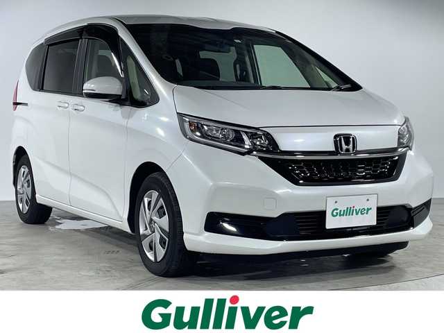 ホンダ フリード ハイブリット G 福岡県 2023(令5)年 3.5万km プラチナホワイトパール 純正7インチSDナビ【VXM-234VFi】/【AM/FM/CD/DVD/Bluetooth/フルセグTV】/バックカメラ/ETC2.0/追従型クルーズコントロール/衝突軽減システム/前後コーナーセンサー/両側電動パワースライドドア/純正フロアマット/LEDヘッドライト/スマートキー/スペアキー×1