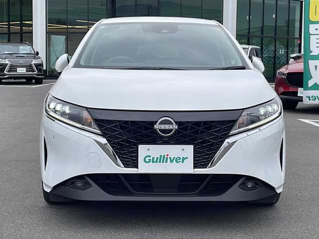 日産 ノート X FOUR 長野県 2021(令3)年 2.2万km ピュアホワイトパール 禁煙車/純正9インチナビ（フルセグTV/Bluetooth/USB）/インテリジェントアラウンドビューモニター/インテリジェントルームミラー/・インテリジェントエマージェンシーブレーキ/・踏み間違い衝突防止アシスト/・ふらつき警報/・標識検知機能/・ハイビームアシスト/・車線逸脱防止支援システム/・後側方衝突防止支援システム/前席シートヒーター/ステアリングヒーター/置くだけ充電/革巻きステアリング/ステアリングスイッチ/電動パーキングブレーキ/ブレーキホールド/LEDヘッドライト/オートライト/スマートキー/Pスタート/電動格納ミラー/純正フロアマット/ドアバイザー/社外AWスタッドレス積み込み