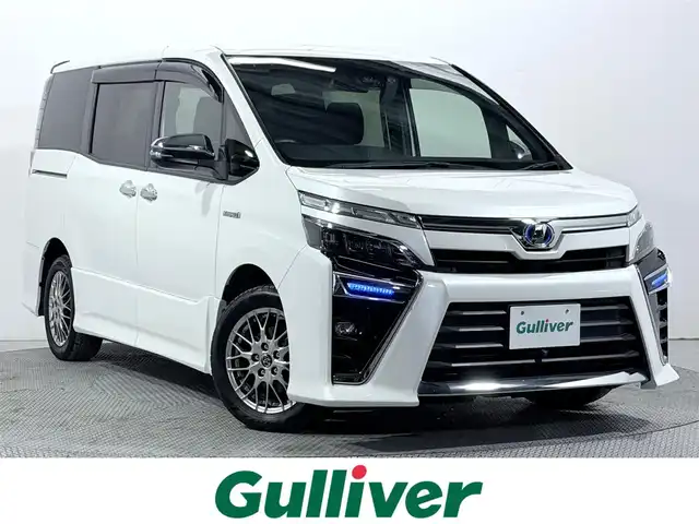 トヨタ ヴォクシー ハイブリッド ZS 煌 大阪府 2018(平30)年 5.2万km ホワイトパールクリスタルシャイン ALPINE11incナビTV バックカメラ シートヒーター クルーズコントロール 衝突軽減ブレーキ レーンアシスト 両側パワースライドドア リアオートエアコン ドライブレコーダー ETC