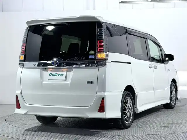 トヨタ ヴォクシー ハイブリッド ZS 煌 大阪府 2018(平30)年 5.2万km ホワイトパールクリスタルシャイン ALPINE11incナビTV バックカメラ シートヒーター クルーズコントロール 衝突軽減ブレーキ レーンアシスト 両側パワースライドドア リアオートエアコン ドライブレコーダー ETC