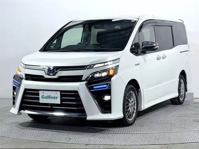 トヨタ ヴォクシー ハイブリッド ZS 煌 大阪府 2018(平30)年 5.2万km ホワイトパールクリスタルシャイン ALPINE11incナビTV バックカメラ シートヒーター クルーズコントロール 衝突軽減ブレーキ レーンアシスト 両側パワースライドドア リアオートエアコン ドライブレコーダー ETC