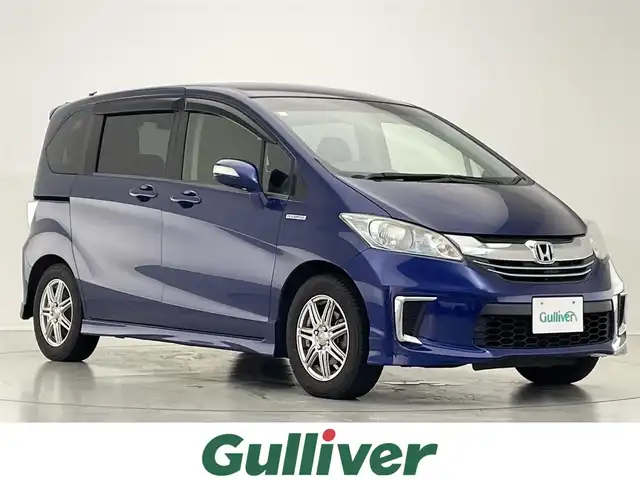 ホンダ フリード ハイブリット プレミアムエディション 滋賀県 2016(平28)年 8.9万km コバルトブルーパール 純正ナビ/CD/DVD/Bluetooth/FM/AM/フルセグテレビ/バックカメラ/ビルトインETC/両側パワースライドドア/クルーズコントロール/フリップダウンモニター/LEDヘッドライト/オートライト/スマートキー/ドアバイザー/ステアリングスイッチ/純正フロアマット