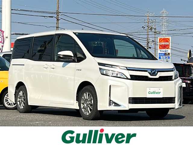 トヨタ ヴォクシー ハイブリッド V 愛知県 2018(平30)年 4.4万km ホワイトパールクリスタルシャイン /禁煙/ワンオーナー//ディーラー整備記録簿H31.R1.2.3.4.5.6//ALPINE9型ナビ/フルセグ/CD/DVD/SD/MSV/BT//バックカメラ/ETC/純正ドラレコ//ALPINE10型フリップダウンモニター//革巻きステア/ステアスイッチ//リアロールサンシェード/シートバックテーブル//両側パワースライドドア//LEDオートライト/オートハイビーム/LEDフォグ//PCS/LDA//クルーズコントロール//前席シートヒーター//オートリトラウインカーミラー//照明付きバニティミラー//プッシュスタート/スマートキー//新車時保証書//取扱説明書//ドラレコ取説//スペアスマートキー