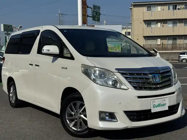 トヨタ アルファードハイブリット G 千葉県 2012(平24)年 10.6万km ホワイトパールクリスタルシャイン 社外10型フローティングナビ/フルセグTV/Bluetooth/バックカメラ/両側電動スライドドア/コーナーセンサー/クルーズコントロール/パワーシート/3列シート/HIDヘッドライト/オートライト/純正16インチAW/前後ドラレコ/ETC/保証書・取説