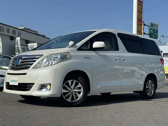 トヨタ アルファードハイブリット G 千葉県 2012(平24)年 10.6万km ホワイトパールクリスタルシャイン 社外10型フローティングナビ/フルセグTV/Bluetooth/バックカメラ/両側電動スライドドア/コーナーセンサー/クルーズコントロール/パワーシート/3列シート/HIDヘッドライト/オートライト/純正16インチAW/前後ドラレコ/ETC/保証書・取説