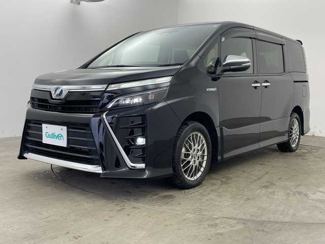 トヨタ ヴォクシー ハイブリッド ZS 煌 兵庫県 2018(平30)年 5.2万km ブラック ・純正9インチナビ(CD/DVD/BT/TV/SD)/・両側パワースライドドア/・純正フリップダウンモニター/・トヨタセーフティセンス/・プリクラッシュセーフティ/・レーンディパーチャーアラート/・クルーズコントロール/・オートマチックハイビーム/・先行車発進告知/・前席シートヒーター/・純正ドライブレコーダー/・ビルトインETC/・純正16インチAW/・プッシュスタート/・スマートキー/・LEDライト　/・LEDフォグランプ/・TRC/・ダブルエアコン