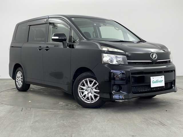 トヨタ ヴォクシー X Lエディション 兵庫県 2012(平24)年 11.6万km ブラック ・社外ナビ（CN-HDS６３０D）/　CD/DVD再生/　ワンセグテレビ/　SD/MD再生/・ビルドインETC/・バックカメラ/・両側パワースライドドア/・三列シート/・前後ドライブレコーダー/・社外フロアマット/・社外15インチアルミホイール/・ABS/・HIDオートライト/・Wエアバック/・ステアリングスイッチ/・アルパインフリップダウンモニター/・リモコンキー