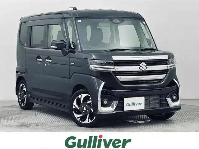 スズキ スペーシア カスタム HYBRID XS ターボ 道央・札幌 2024(令6)年 0.8万km ブルーイッシュブラックパール3 ・4WD/・デュアルセンサーブレーキサポートII/・レーダークルーズコントロール/・両側PSドア/・社外メモリーナビ（SKX-S807）/　CD/DVD/SD/USB/Bt/iPod/フルセグ/・LEDヘッドライト/・オートハイビーム/・オートライト/・HUD/・黒ハーフレザーシート/・シートヒーター（D/N）/・ステアリングヒーター/・前後コーナーセンサー/・パドルシフト/・オートブレーキホールド/・ビルトインETC/・ヘッドライトレベライザー/・スマートキー/・プッシュスタート/・純正15inchアルミ/・保証書（有）/・社外マフラー（柿本改 GT box 06＆S）