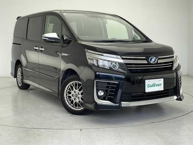 トヨタ ヴォクシー ハイブリッド ZS 煌Ⅱ 千葉県 2017(平29)年 6.2万km ブラック 社外SDナビ/フルセグTV/Bluetooth/CD/DVD/バックカメラ/前方ドライブレコーダー/ビルトインETC/両側パワースライドドア/衝突被害軽減ブレーキ/レーンキープアシスト/ISOFIX/スマートキー/純正アルミホイール/LEDヘッドライト