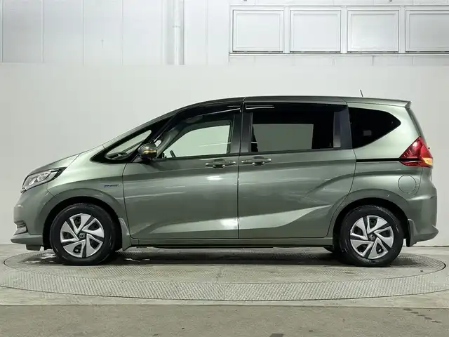 ホンダ フリード ハイブリット G ホンダセンシング 大阪府 2020(令2)年 4.5万km シルバーミストグリーンM 純正9incナビ(フルセグ/DVD再生/Bluetooth) バックカメラ ETC 両側パワースライドドア シートヒーター 衝突軽減 レーダークルコン レーンアシスト 前後ドラレコ オートライト