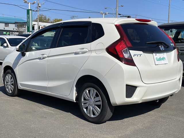 ホンダ フィット 13G Lパッケージ 道東・釧路十勝 2015(平27)年 6.5万km プレミアムホワイトパール 4WD/寒冷地仕様/純正メモリナビ　VXM-145VSi/　(AM/FM/CD/DVD/BT)/バックカメラ/アイドリングストップ/社外ETC/ステアリングスイッチ/スマートキー/LEDヘッドライト