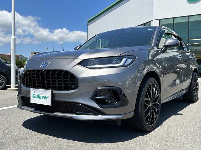 ホンダ ＺＲ－Ｖ ハイブリッド e:HEV Z 愛媛県 2023(令5)年 1.8万km スーパープラチナグレーメタリック 登録時走行距離：17348Km/メーカーオプション純正ナビ/フルセグTV/Bluetooth/全周囲カメラ/前後ドライブレコーダー/ビルトインETC2.0/横滑り防止装置/レーンキープアシスト/レーダークルーズコントロール/LEDヘッドライト/オートライト/エンジンスタートボタン/スマートキー/純正フロアマット/本革シート/ステアリング/オートホールド/BOSEスピーカー/シートーヒーター/ワイヤレス充電/電動リアゲート